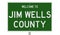 Road sign for Jim Wells County