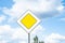 Road sign main road traffic priority against blue sky background