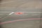 Road sign markings on runway surface for airplane taxiing traffic