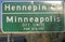 Road sign of Minneapolis, MN and Hennepin