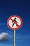 Road sign pedestrians are forbidden to pass with the sky