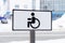 Road sign - place for invalid disabled people in parking lot in city.