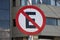 Road sign on a pole letter E crossed out no parking