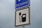 Road sign reserves reservations for electric cars. Charging station with petrol stand symbol with cable and plug for electric batt