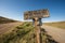 Road sign in rural California in Sierra Nevada hills and mountains