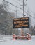 Road sign in snow warning of polar vortex