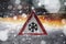 Road sign snow warns of snow and ice in winter, warning sign