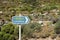 Road sign in Tilos island, direction to the village, road sign, important information on the road, blur photo