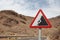 Road sign warning of falling rocks in spain