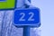 Road sign in winter forest, twenty second kilometer