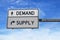 Road sign with words demand and supply. White two street signs with arrow on metal pole. Directional road  Crossroads Road Sign