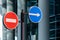 Road signs against modern glass building background