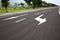 Road signs arrows on asphalted surface