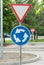 Road signs on a background of trees, give way, roundabout, travel is prohibited