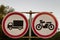 Road signs, road sign on a background of trees, the movement of trucks is prohibited, the movement of motorcycles is prohibited, p