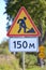 Road signs Roadwork, Distance of 150 m against greens