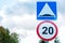 Road signs speed limit and artificial road unevenness against the sky