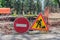 Road signs warning of construction work and a ban on travel