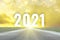 Road and sky in trend colors vibrant Illuminating yellow and ultimate gray with inscription numbers 2021 year in the sky over the