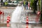 Road spurt water beside traffic cones