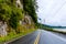 Road by a steep rocky cliff in Canada