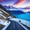 a road on a steep slope and the snow capped Lake Wakatipu Mount at sunset in New