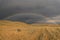 Road steppe rainbow mountains storm