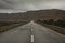 The road stretches among the rocks of the Negev desert