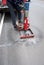 Road surface drilling machine, asphalt asphalt concrete road, workers, check the surface layer thickness, water on the floor, red