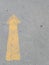 Road surface with yellow arrow sign, outdoor symbol, going to increase symbol
