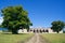 The road, thick linden and an abandoned palace of culture