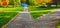 The road to childhood. Pedestrian alleys among the grass lead from the hill to the playground in the form of a fairytale castle.