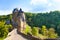 Road to the Eltz castle with towers, in hills