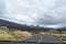 Road to foggy clouds on the track to the Teide volcano in Tenerife with a car window, natural background