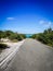 road to lagoon with turquoise water and trees all around in Chalk Sound, Providenciales, Turks and Caicos