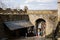 Road to medieval gothic castle Bezdez, grey stone ruin on hill at sunny day, ancient fortress walls, fairytale stronghold,