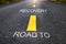 Road to recovery word on asphalt road surface with marking lines