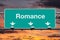 Road to Romance Highway Sign with Sunrise Sky
