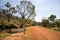 A road to Swan River Tunnel and a visitor sign near National Park Falls at John Forrest National park