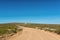 Road to Tietiesbaai near Paternoster. Wild flowers are visible