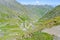 Road to Tusheti, Georgia, Europe. A breathtaking view of serpentine road from Torha Pass to Omalo