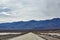 Road towards mountains, Death Valley, USA