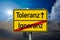 Road or traffic sign with german words for tolerance and ignorance - Toleranz und Ignoranz