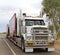 Road train is transporting consumer goods in the Outback, Australia