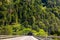 Road tunnel in Alpine mountains, Switzerland. Panoramic view of entrance of tunnel in Alps