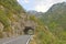 Road tunnel in green Tara Canyon, Montenegro