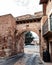 Road under the   beautiful medieval-styled arch