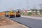 Road under construction, pneumatic tyred roller paver at asphalt