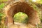 Road under historical arch from red bricks in Kachanivka park