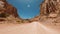 Road view of a car driving across the Zion National Park in summer season